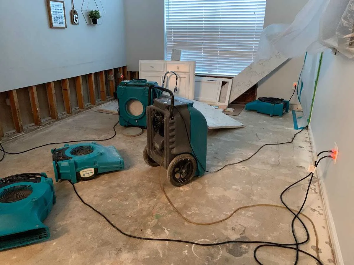 Dehumidifier in flood-cut room for Water Damage Restoration in Lake Mills